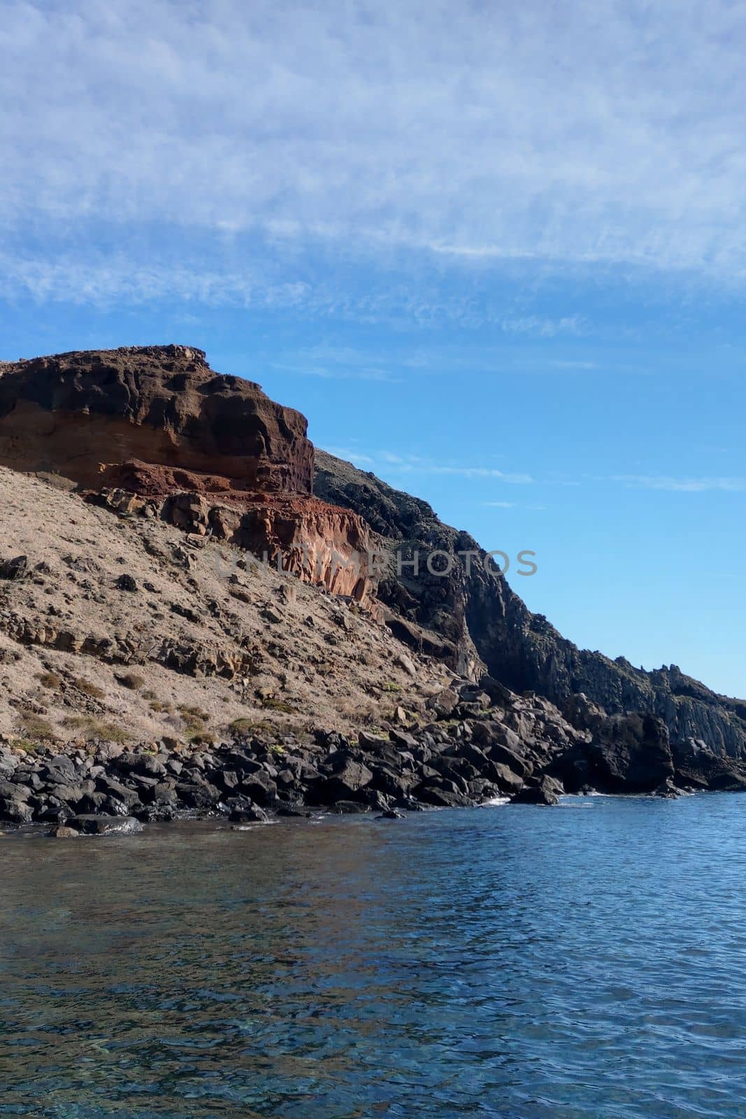 Close-up on dark red-yellow mountains on the island