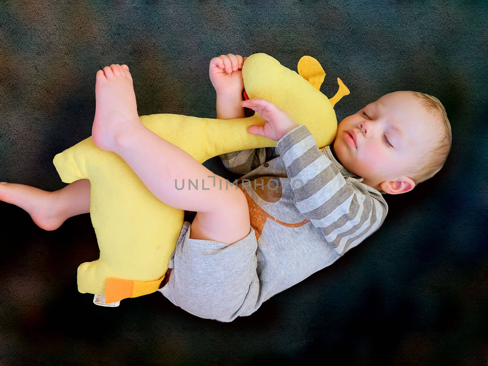 Cute little kid sleeping. Little boy sleeping in bed Cute little boy sleeping, tired child taking a nap in his small bed, clean, fresh and cozy bedding sheets, bedtime for kids. High quality photo