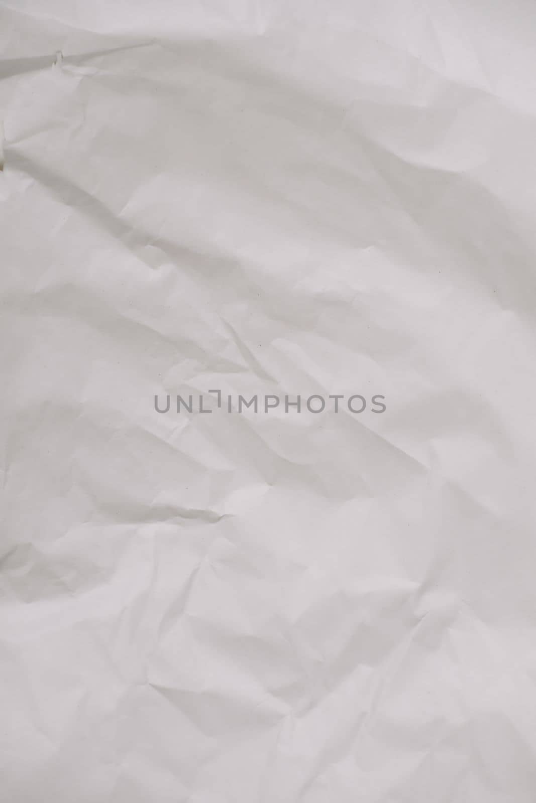 Recycled crumpled white paper texture background for design with copy space for text.