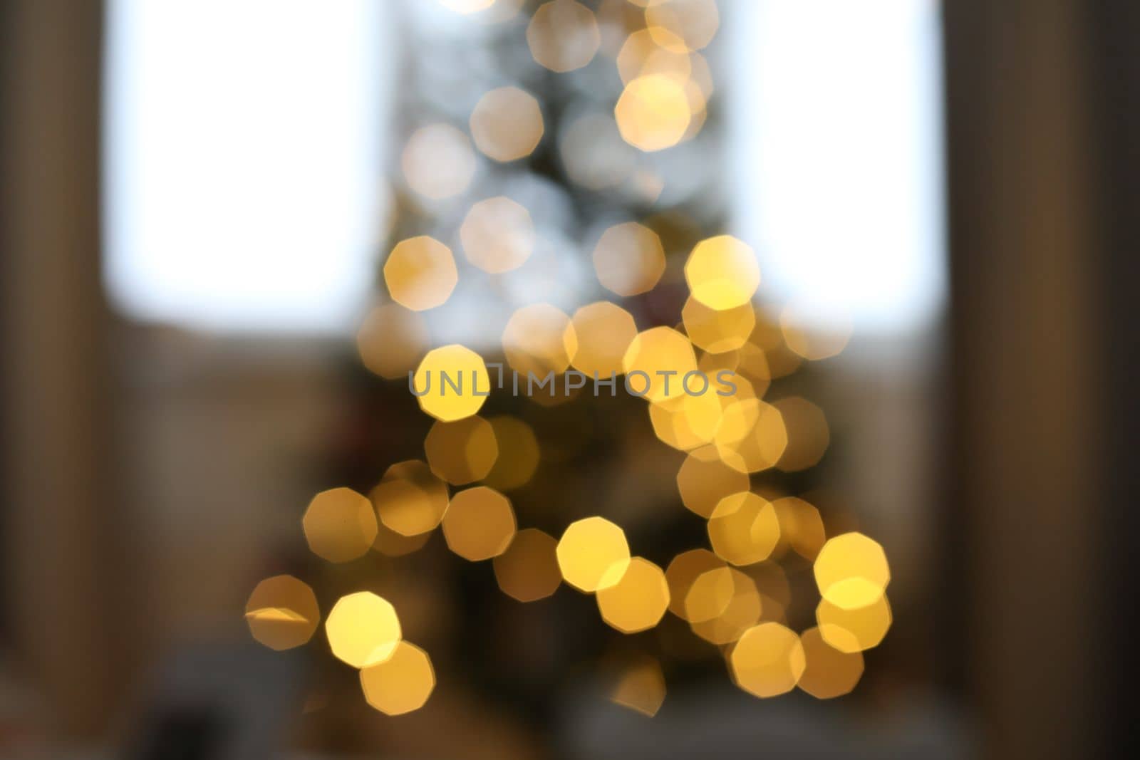 christmas background with christmas tree out of focus. abstract christmas background with defocused lights.