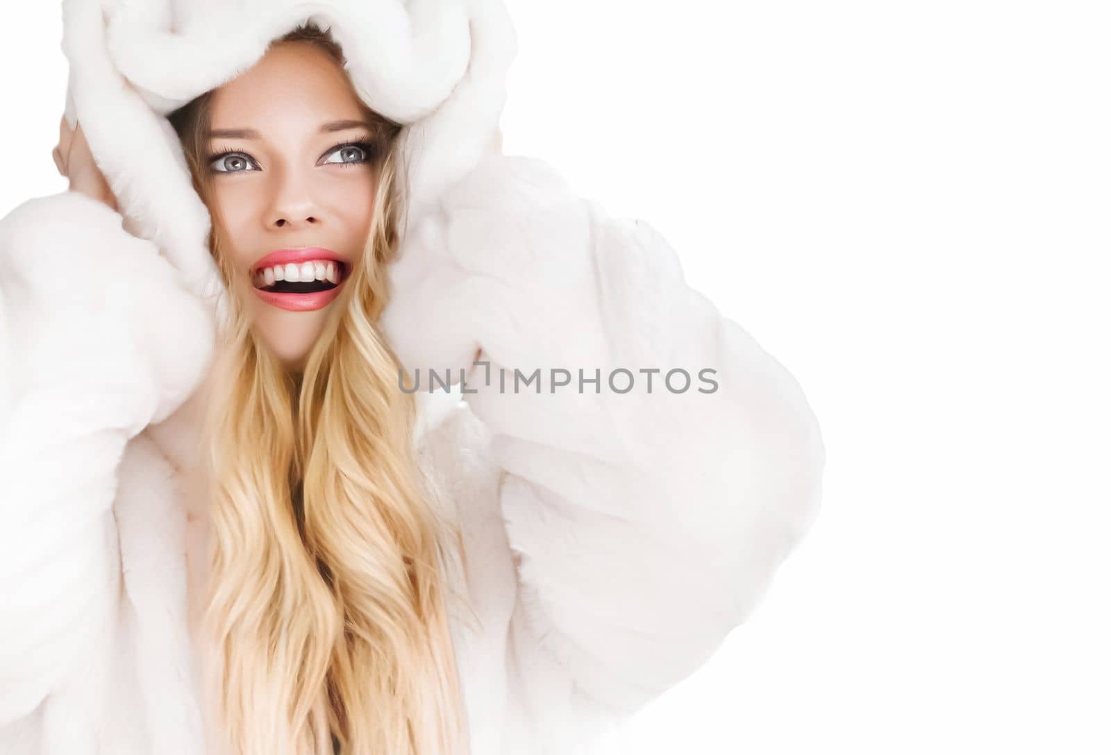 Beautiful woman in white fur coat, beauty and winter fashion.