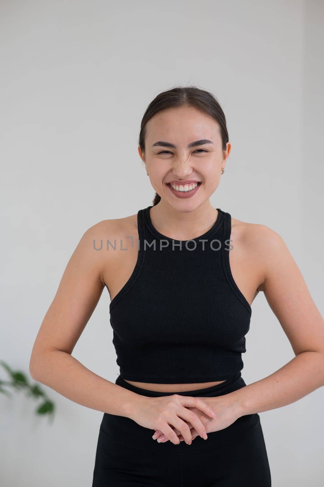 Portrait of a smiling Asian woman on a white background