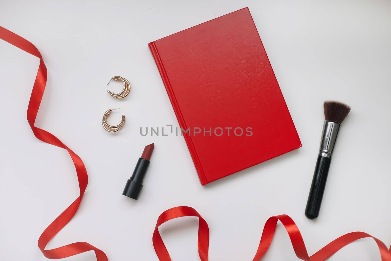 Lipsticks, cosmetic makeup products and accessories flatlay top view. Concept Women's Day, Valentines Day, March 8.