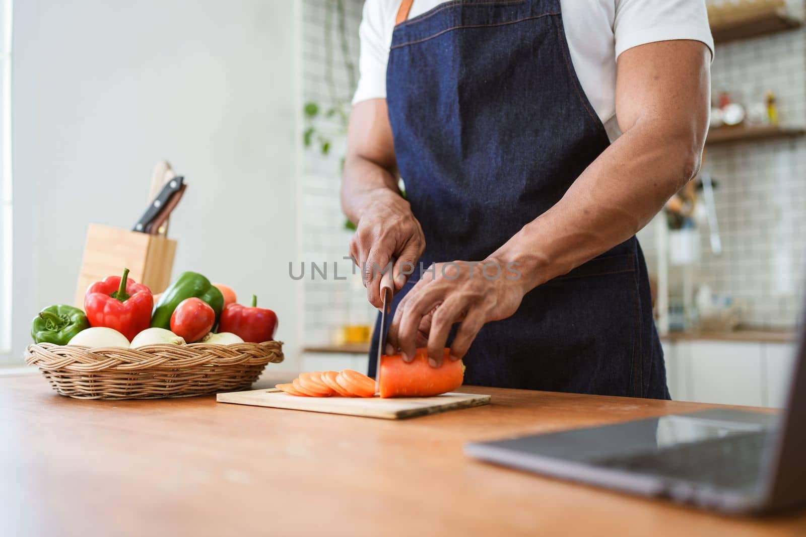 Portrait of asian man making salad at home. cooking food and Lifestyle moment by itchaznong