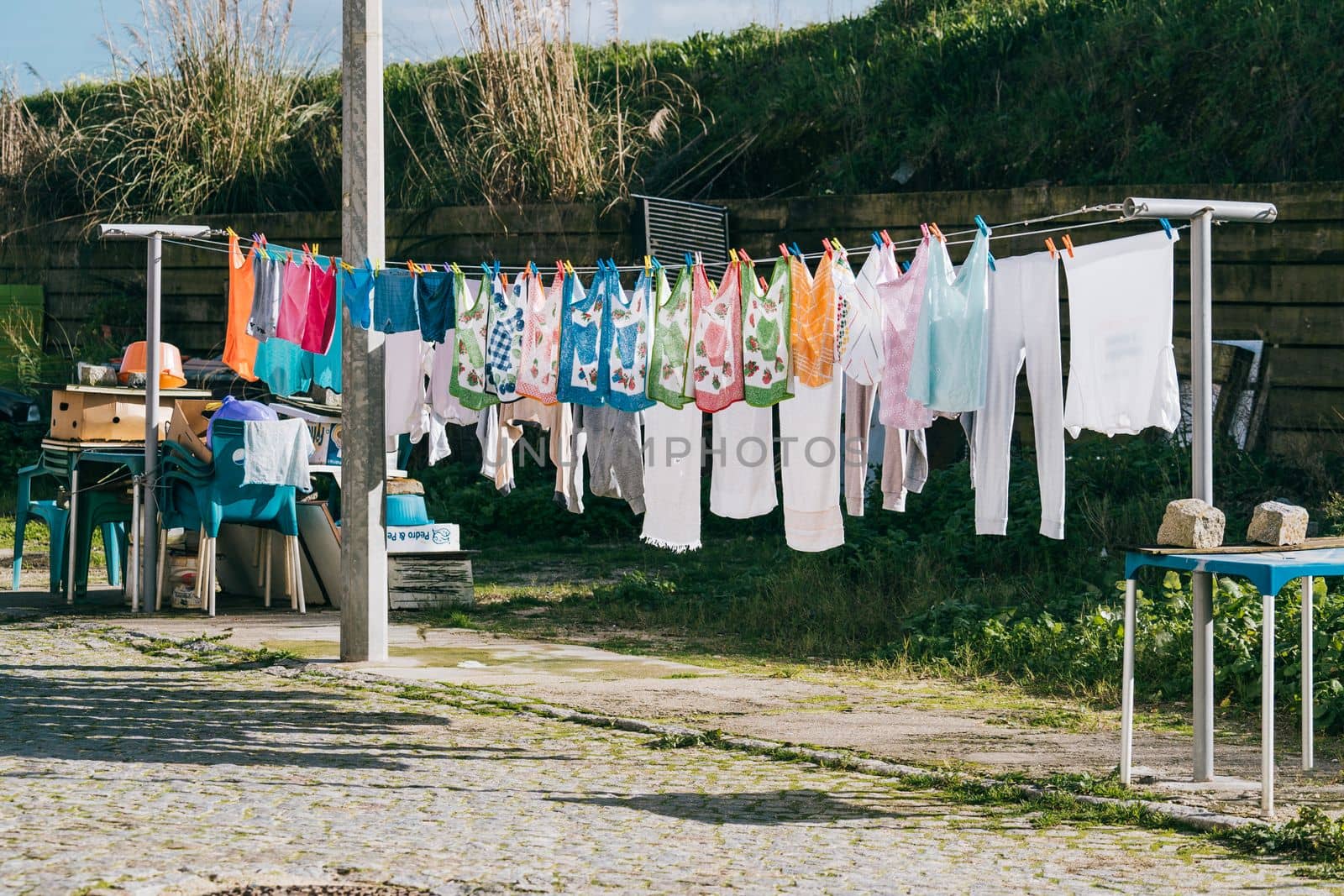 Clothesline getting dried on a bright and sunny afternoon in Espinho , Portugal by papatonic