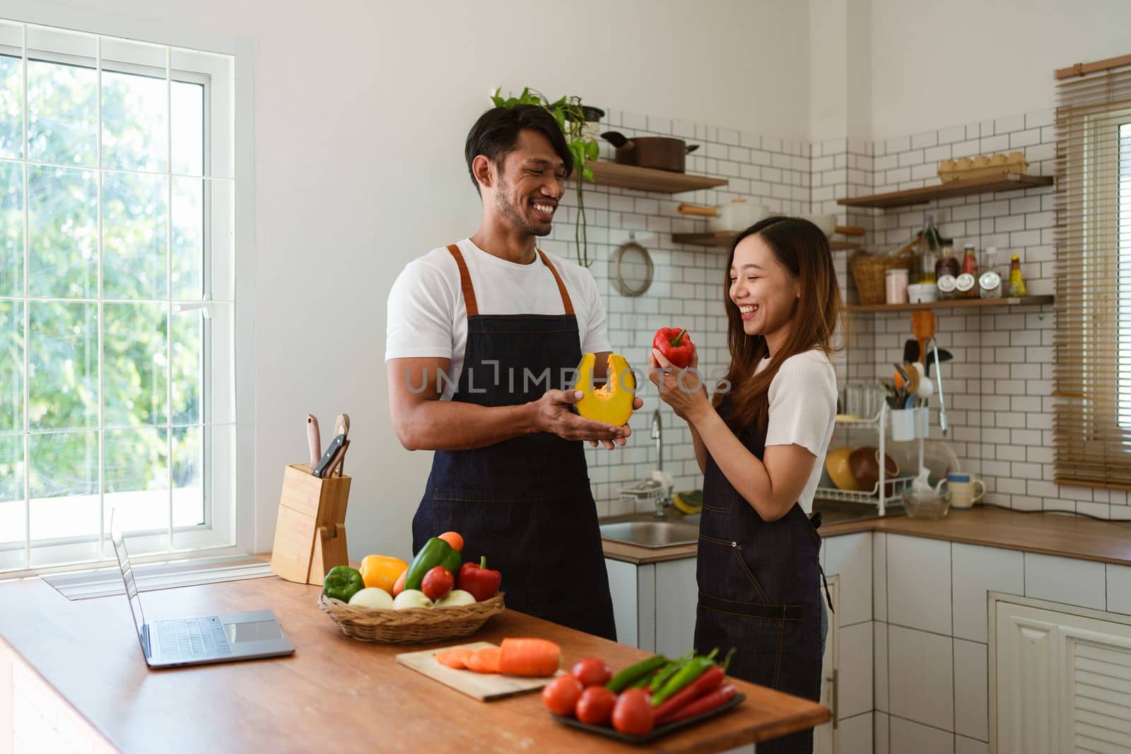 Portrait of young asian couple making salad together at home. cooking food and Lifestyle moment and healthy.