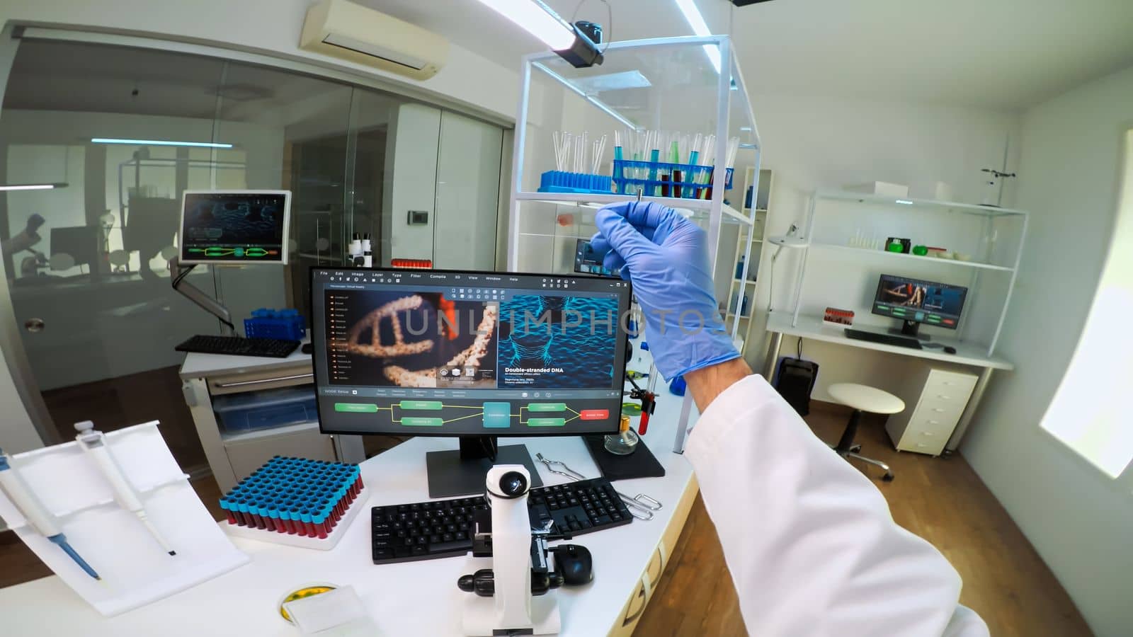 POV of scientist looking at biological samples under microscope typing on pc. Team of chemists working in lab, examining virus evolution using high tech for scientific research of vaccine development.
