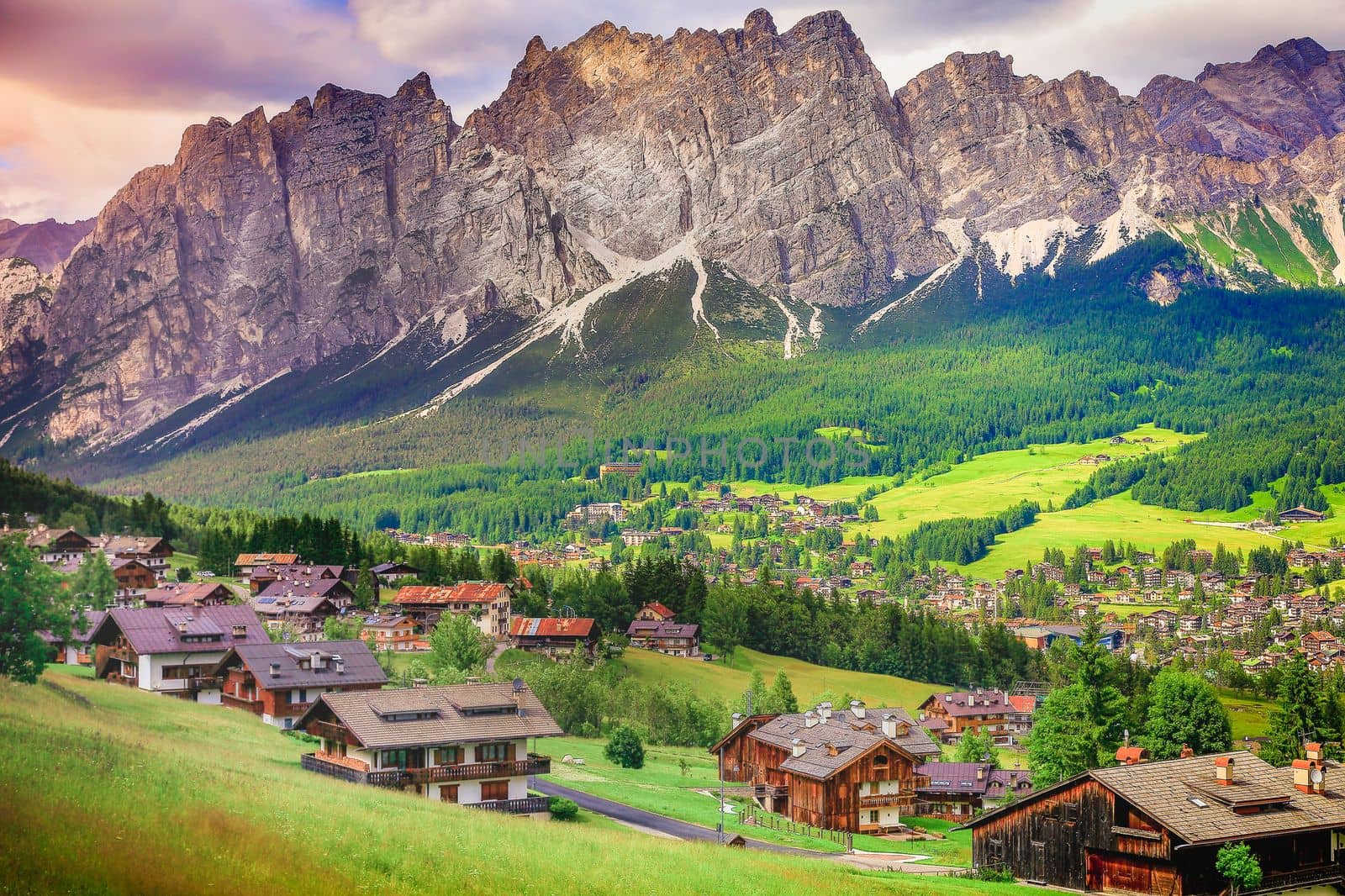 Langkofel and alpine village, Sassolungo pinnacles, Dolomites sudtirol, near Cortina d Ampezzo, Italy