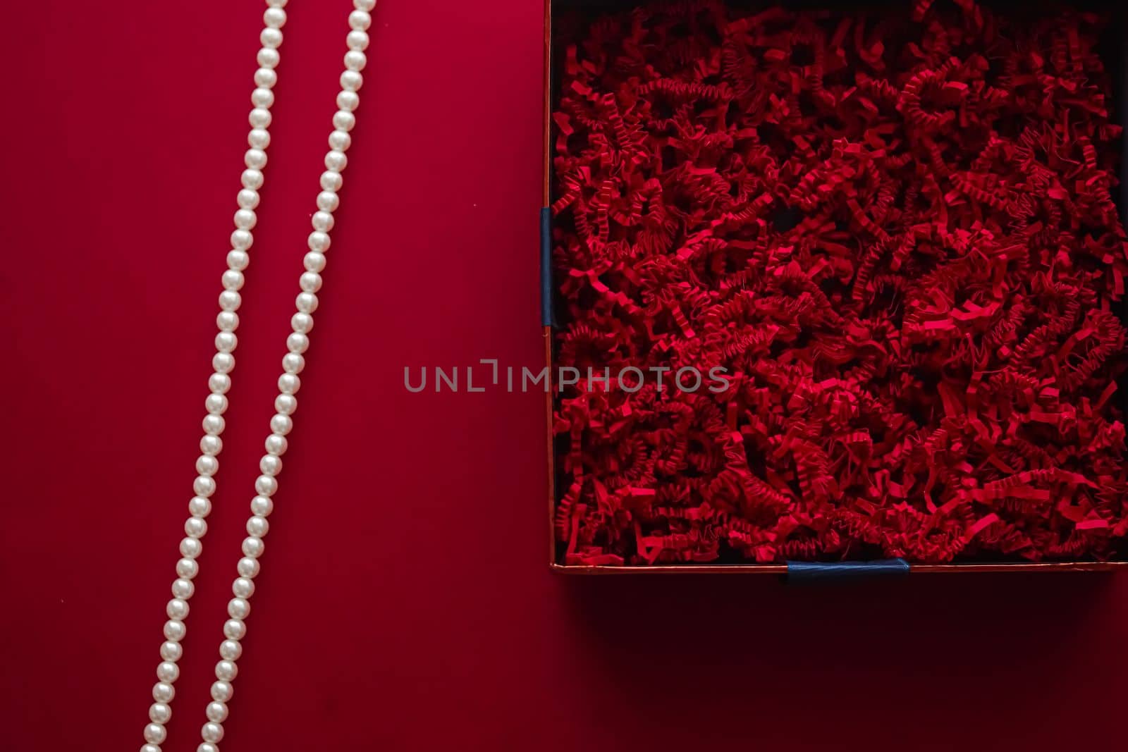 Holiday gift, pearl jewellery necklace and beauty box subscription package mockup for luxury present, empty open gift box flat lay on red background as online shopping delivery, flatlay.