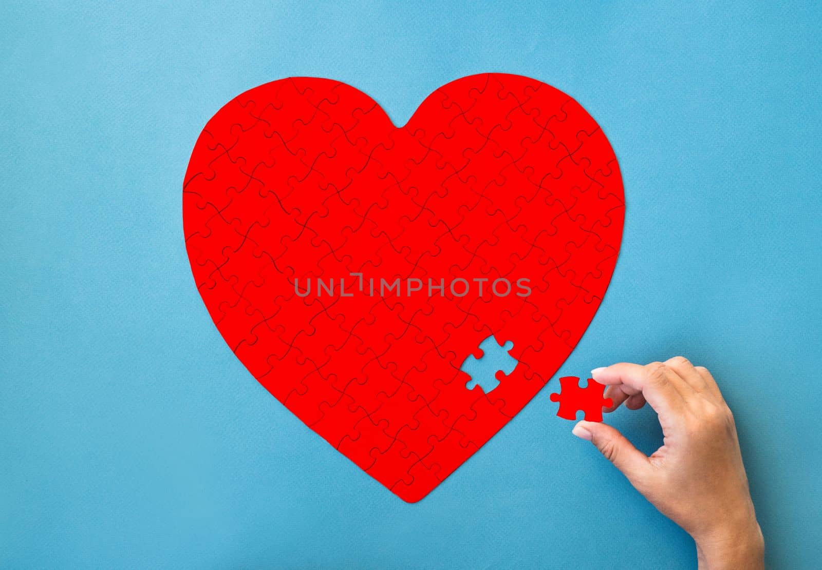 Red puzzle in heart shape by GekaSkr