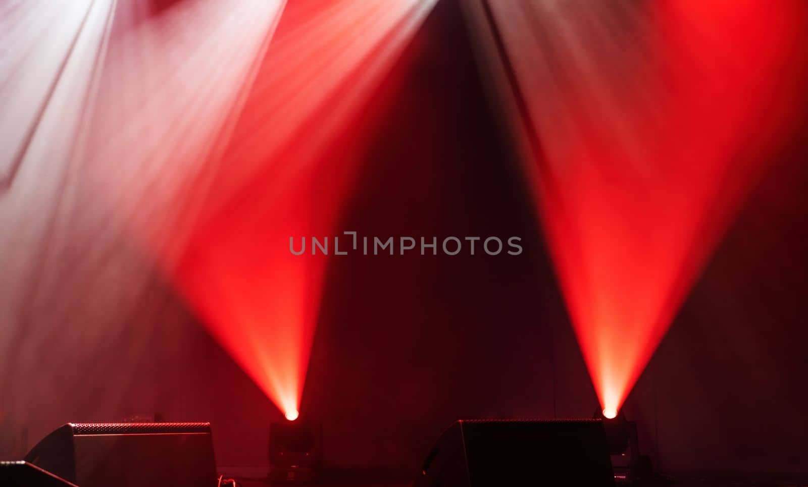 Light on a free stage, scene with red spotlights on a background