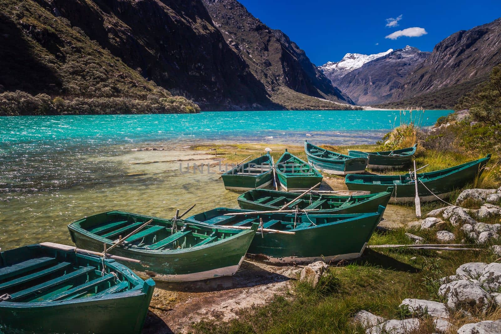 Turquoise Llanganuco lake in Cordillera Blanca at sunny day, snowcapped Andes, Ancash, Peru