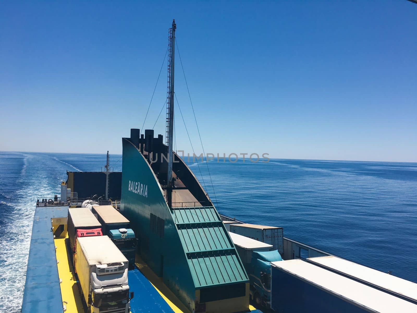 Ferry in Ibiza spain heading to barcelona with cars and passengers. High quality photo