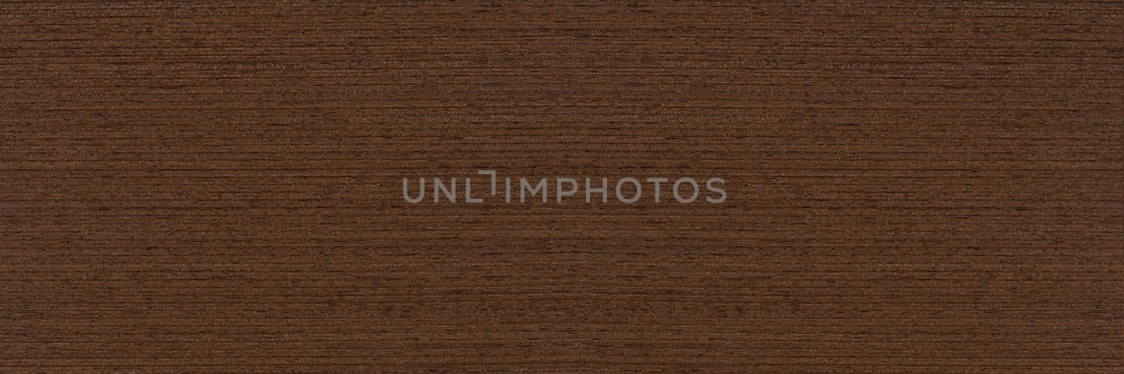 Texture of wenge wood. Dark brown wood for furniture or flooring. Close-up of a Wenge wooden plank, top view