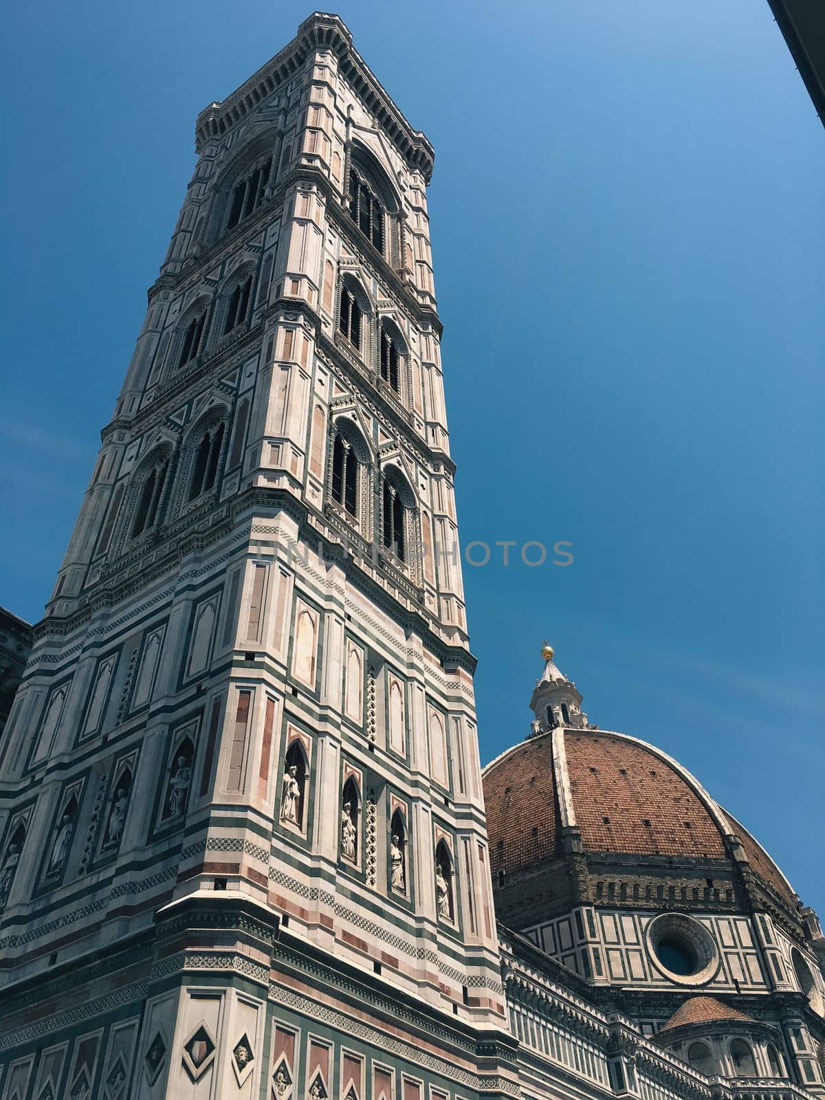 Florence city hall in the middle of town in summer time with people out enjoying the view. High quality photo