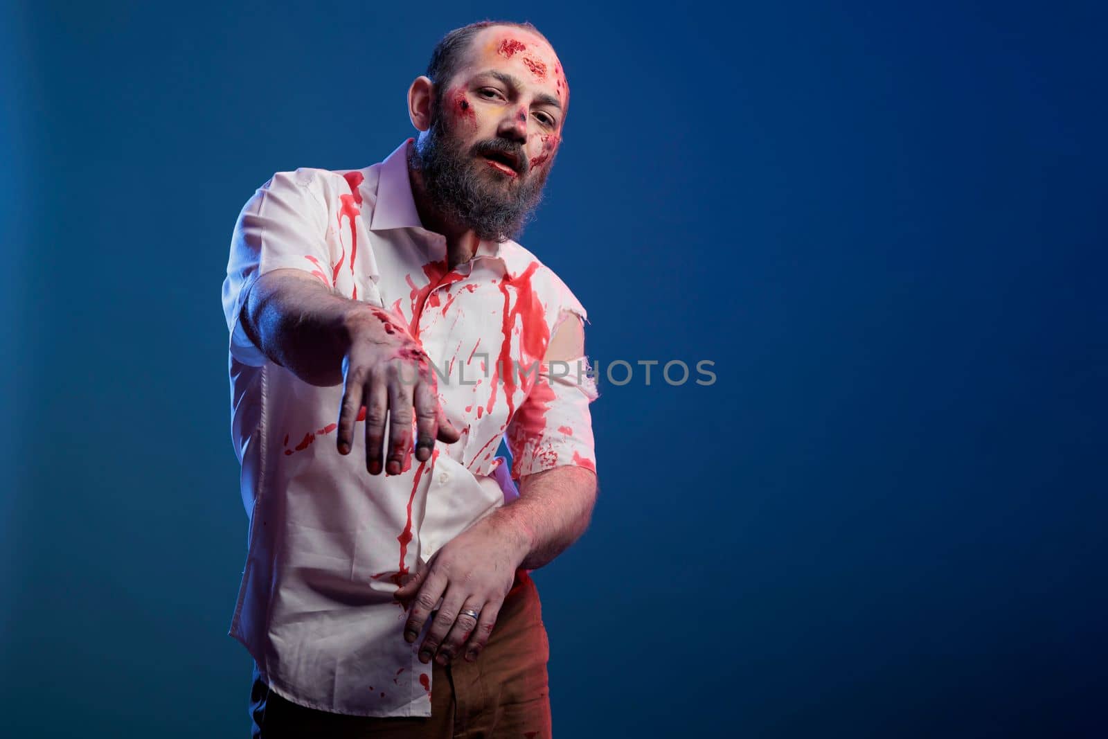 Halloween cruel zombie with bloody wounds by DCStudio
