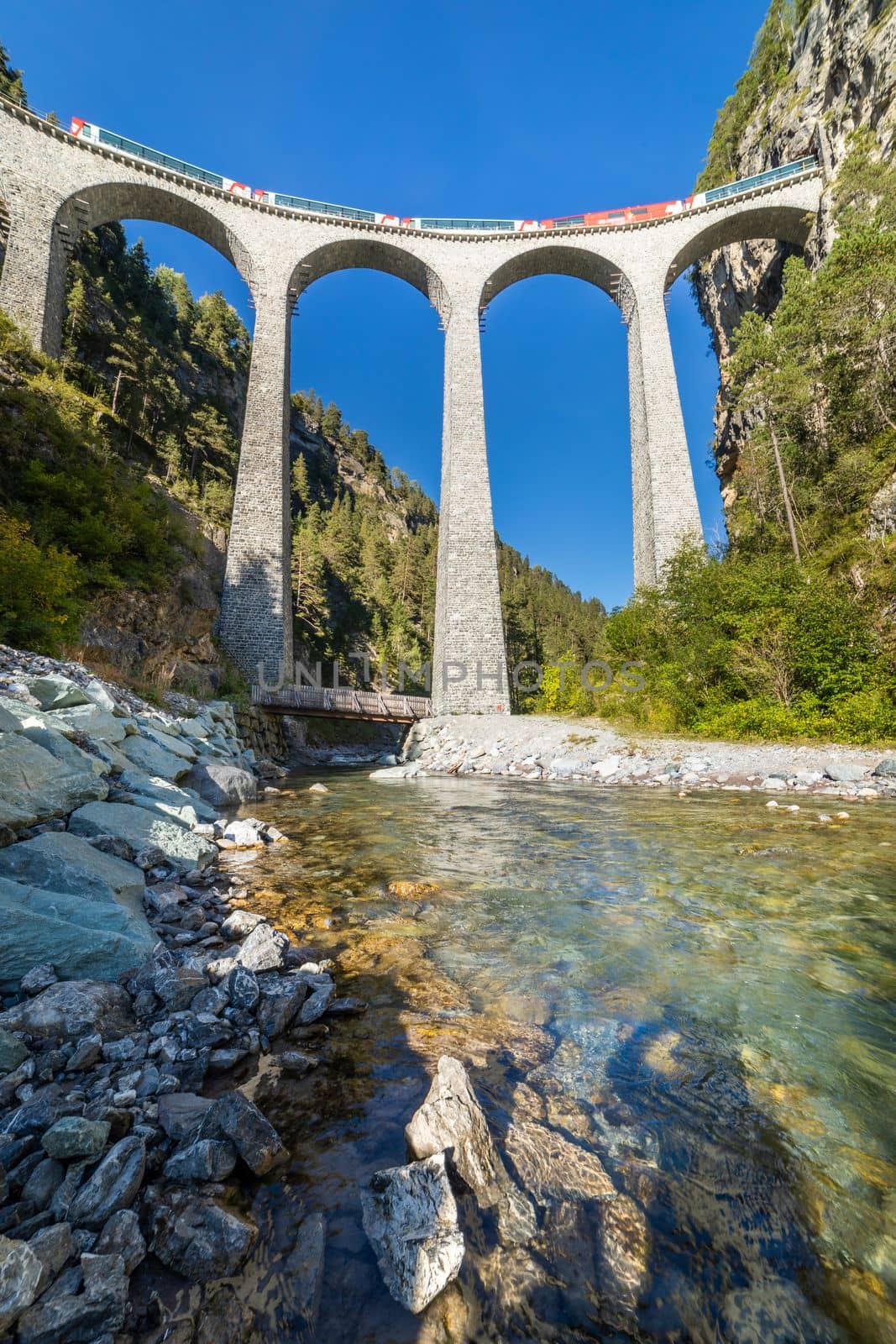 Swiss train over Landwasser Viaduct bridge in the alps, Graubunden valley, Switzerland