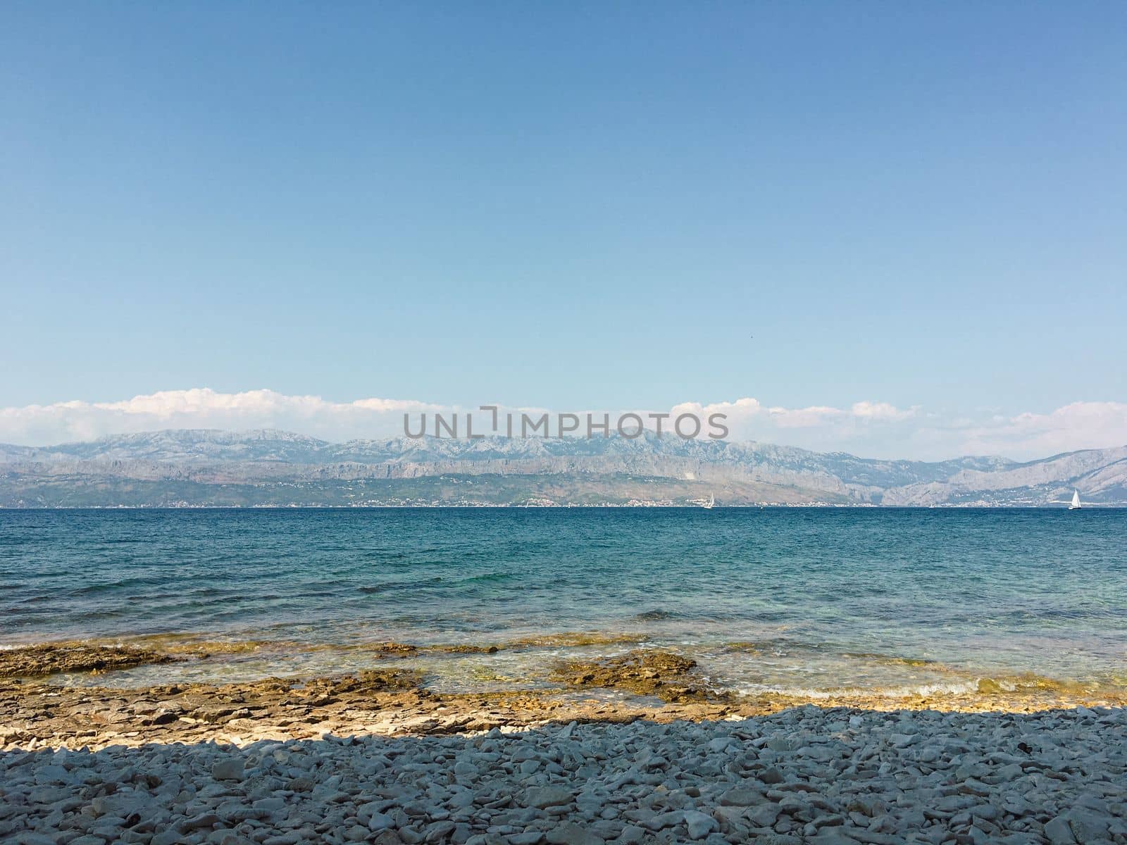 Brac Island Croatia in the middle of summer. With boats and people enjoying summer in the sandy bay. . High quality photo