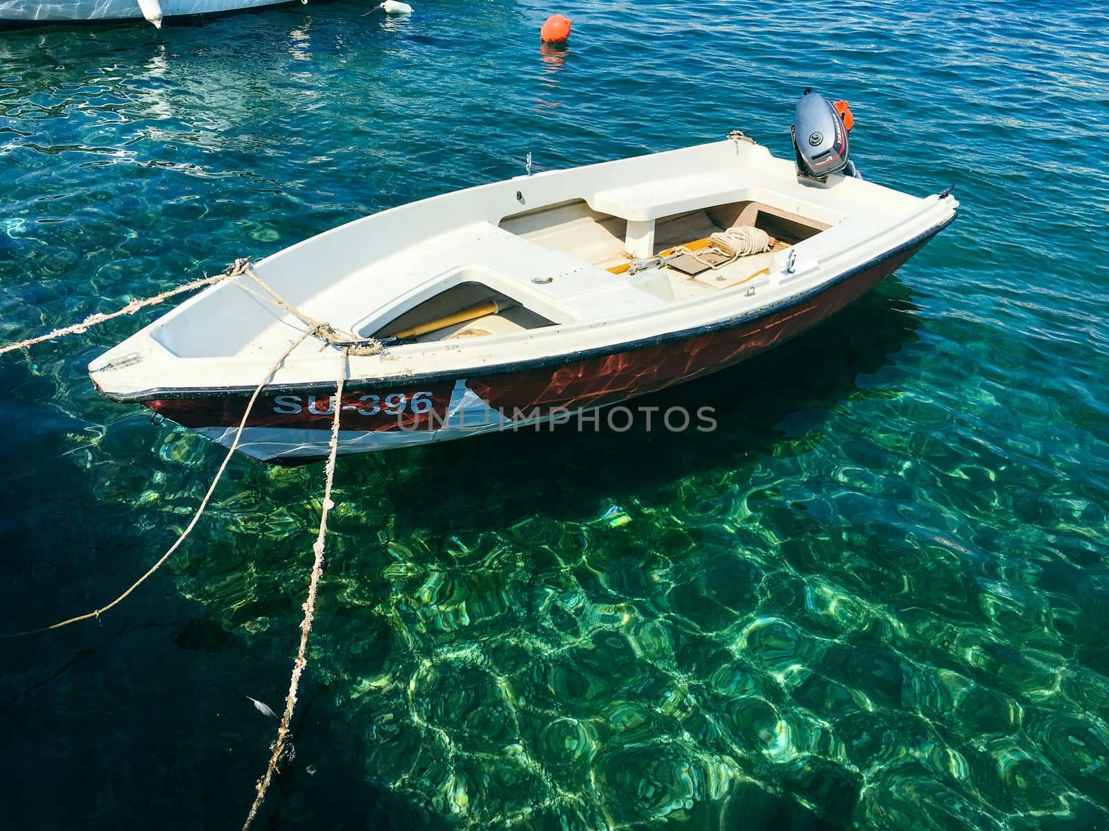 Brac Island Croatia in the middle of summer. With boats and people enjoying summer in the sandy bay.  by WeWander