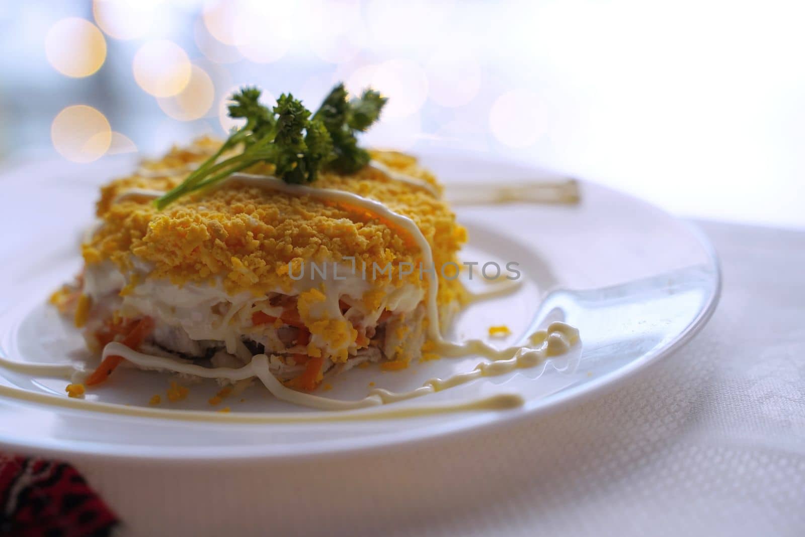 Traditional Ukrainian food on the table with embroidered tablecloth.