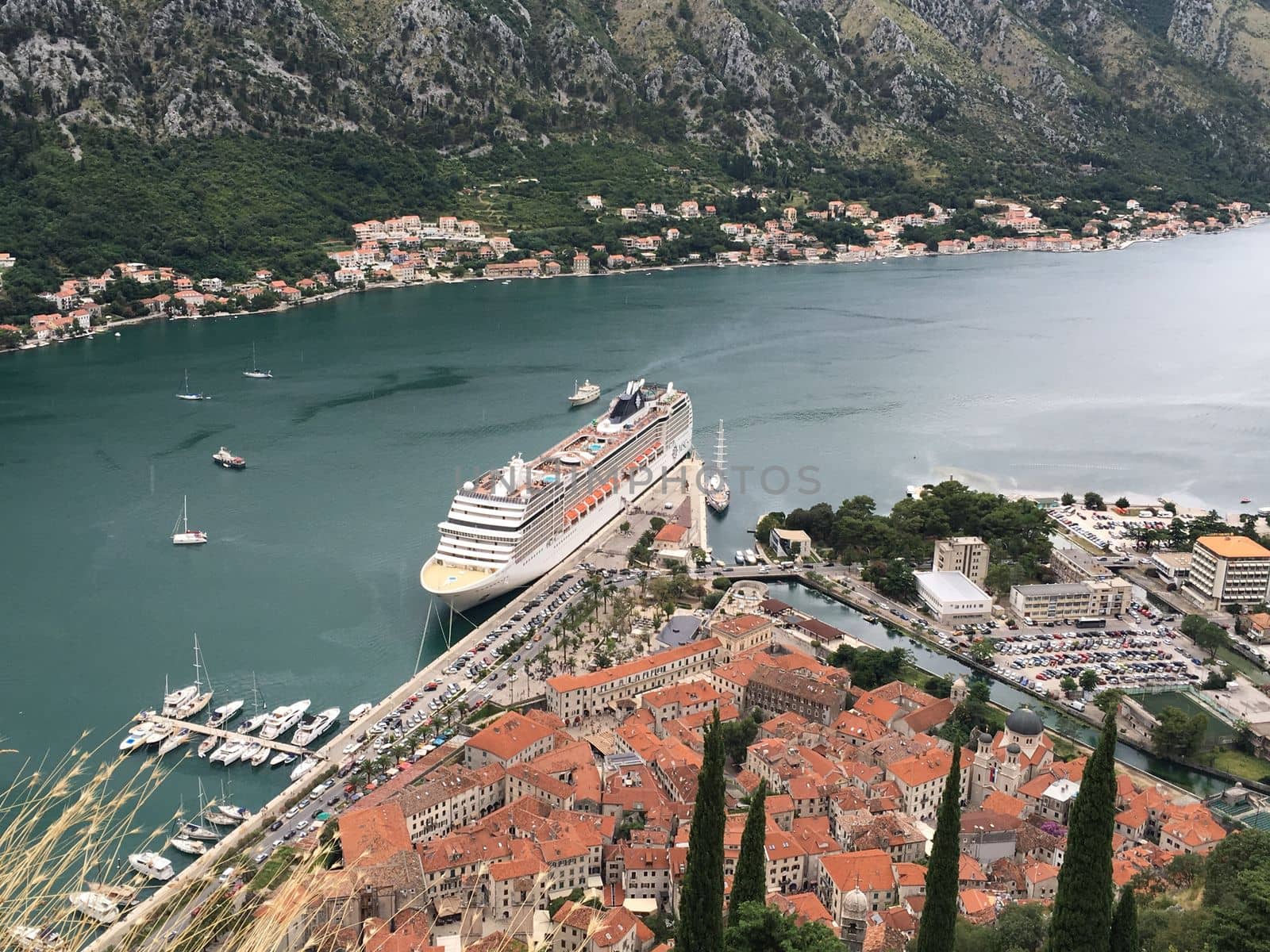 Views overlooking the city streets and waterfront of Kotor Montenegro in a european summer by WeWander