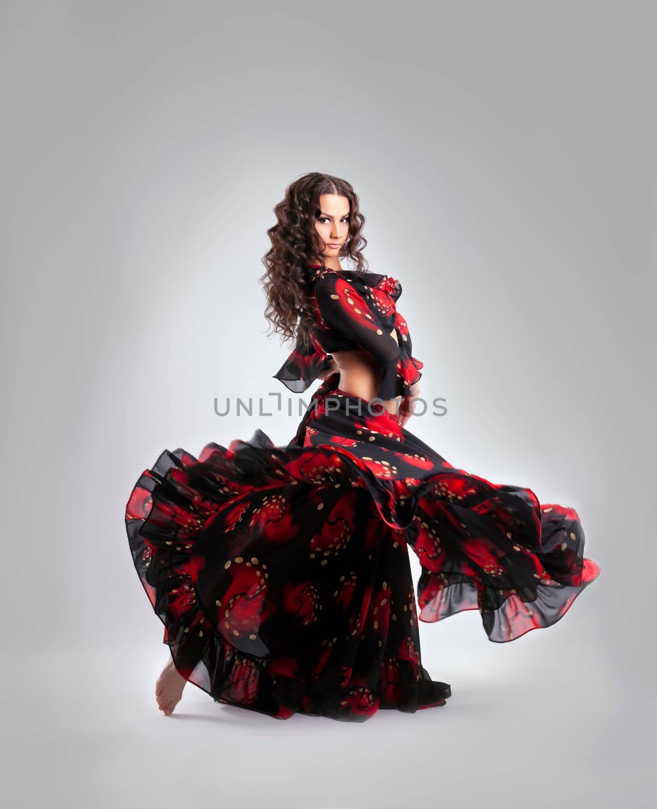 Woman dance in gypsy red and black costume isolated