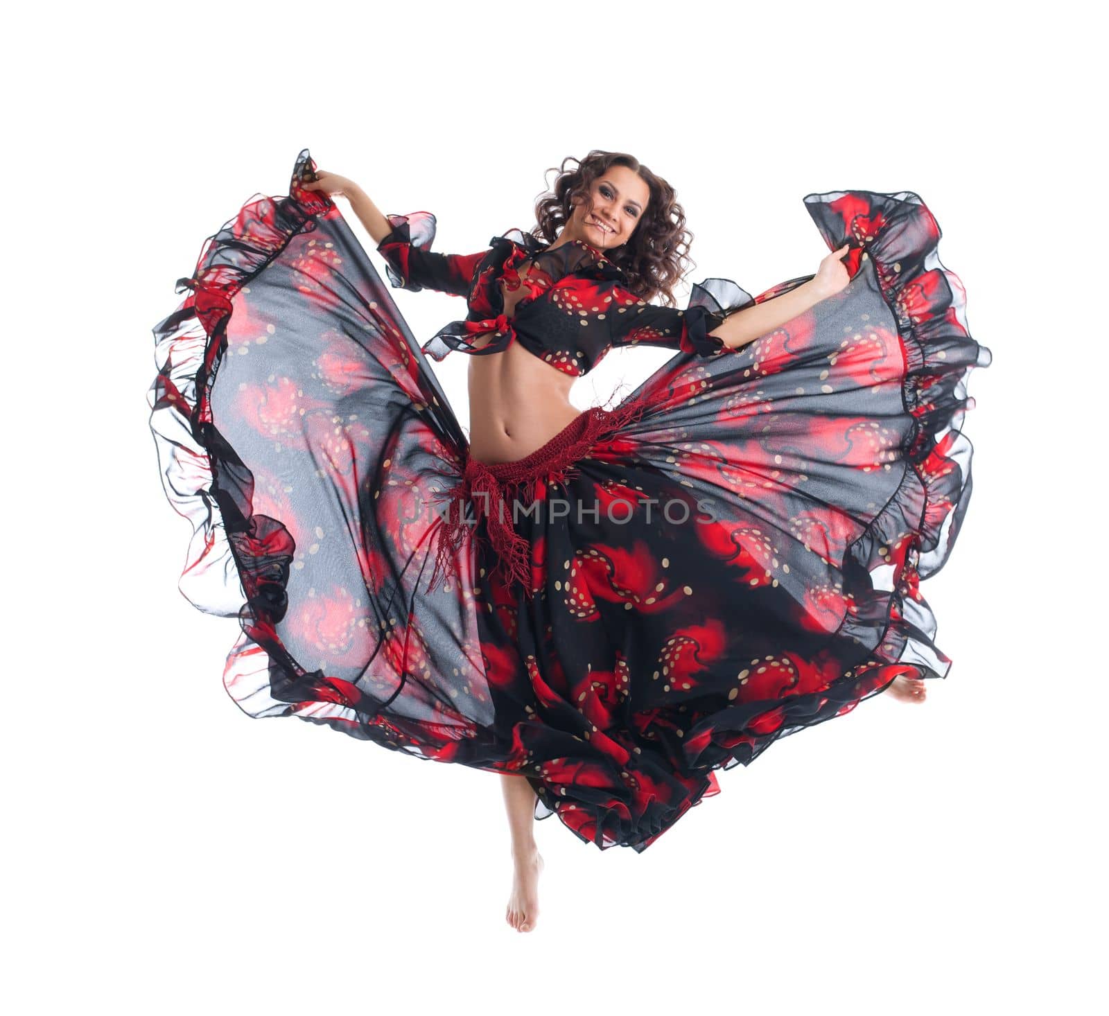 Beauty girl jump in gypsy dance isolated by rivertime