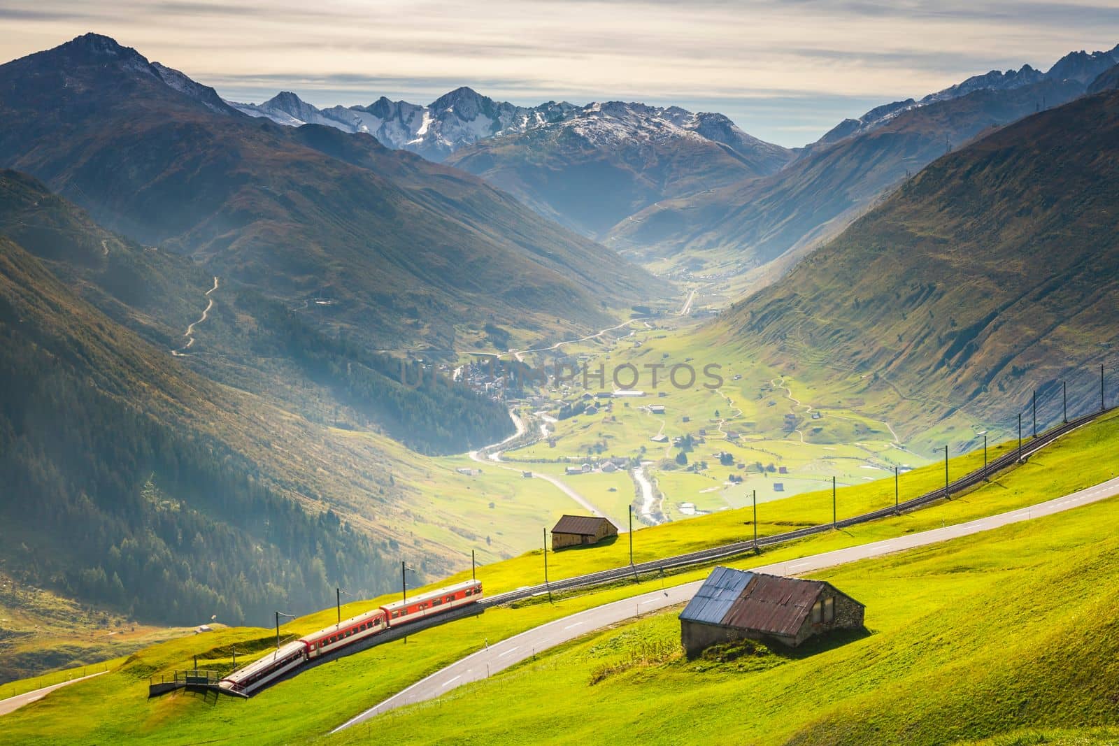 Swiss train in the alps mountains around Andermatt Urseren valley, Uri, Switzerland