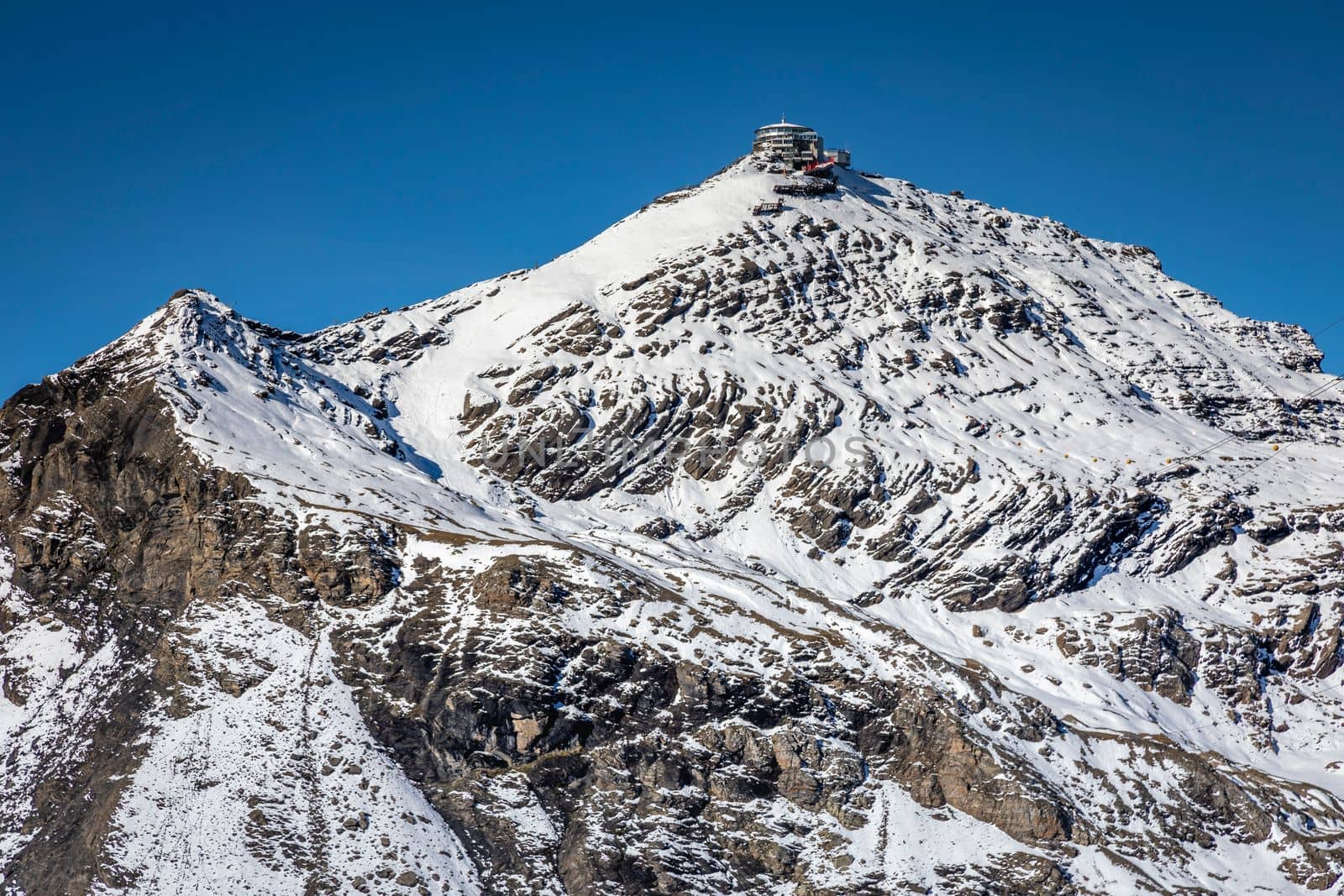 Top of the Schilthorn and view of Snowcapped Bernese Swiss alps, panorama of Eiger, Monch and Jungfrau, Switzerland