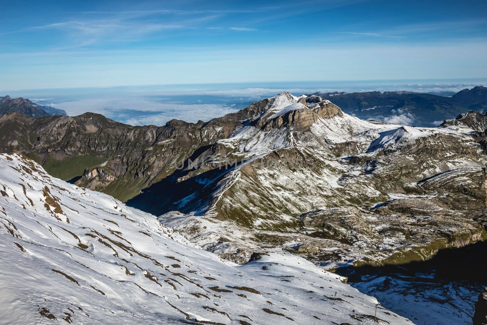 Top of the Schilthorn and view of Snowcapped Bernese Swiss alps, panorama of Eiger, Monch and Jungfrau, Switzerland