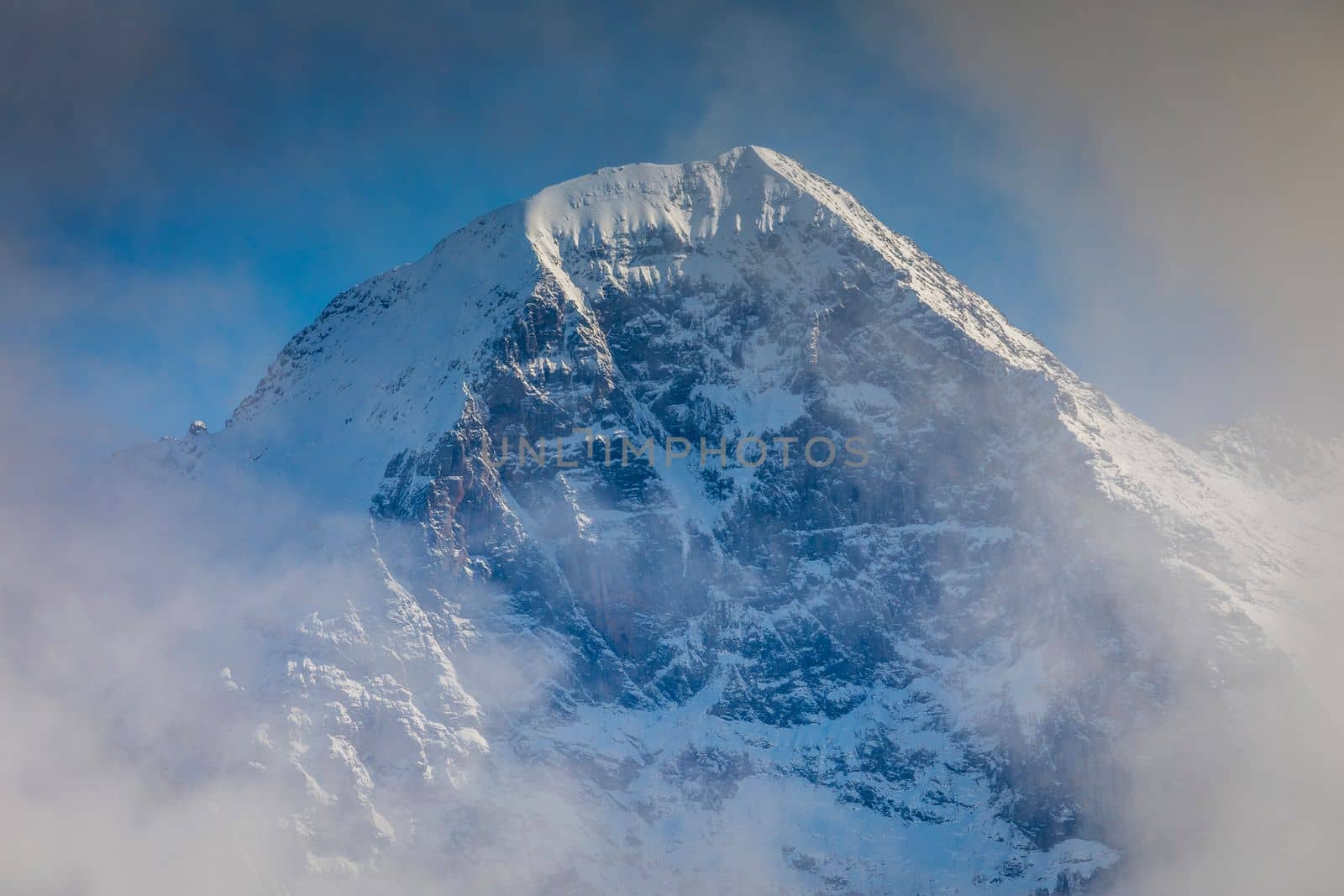 Misty Eiger Mountain, Snowcapped Bernese Swiss alps, view from Schynige Platte, Switzerland