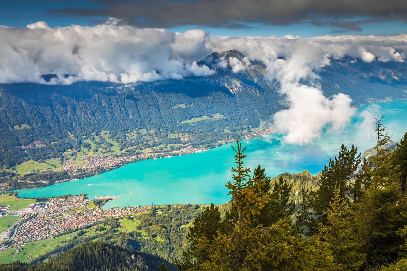 Aerial view of Swiss Alps and Lake Brienz at dramatic sunset, Interlaken, Switzerland