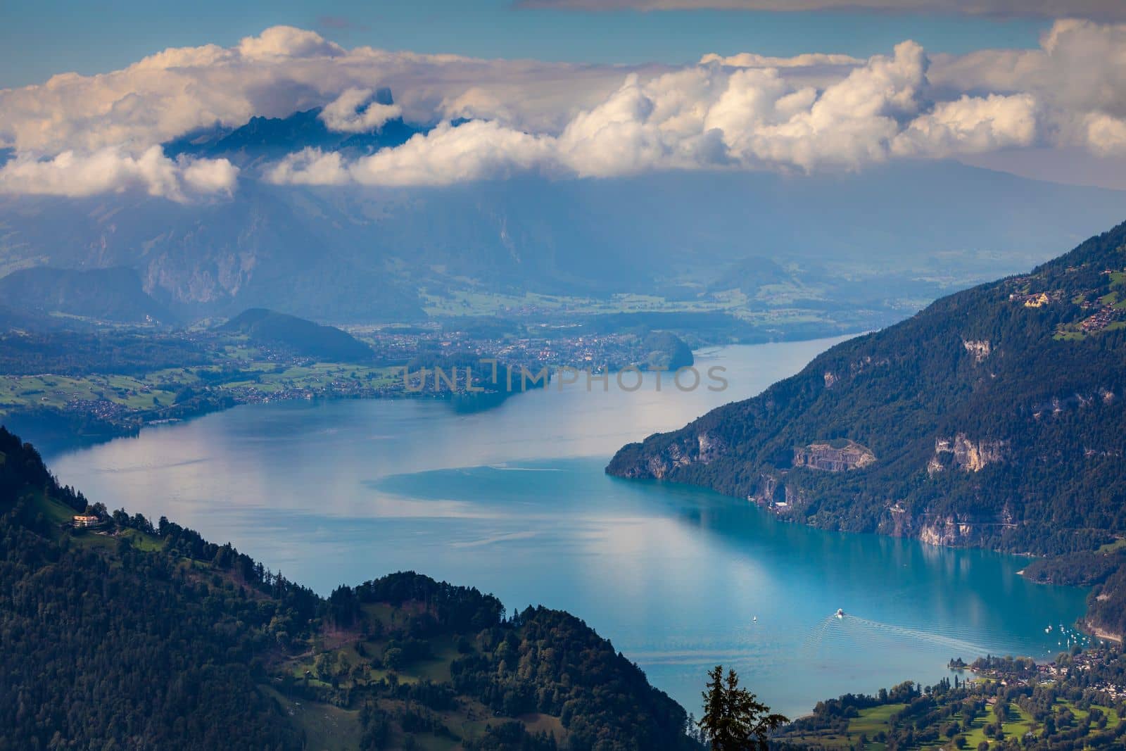 Aerial view of Swiss Alps and Lake Thun at dramatic sunset, Interlaken, Switzerland