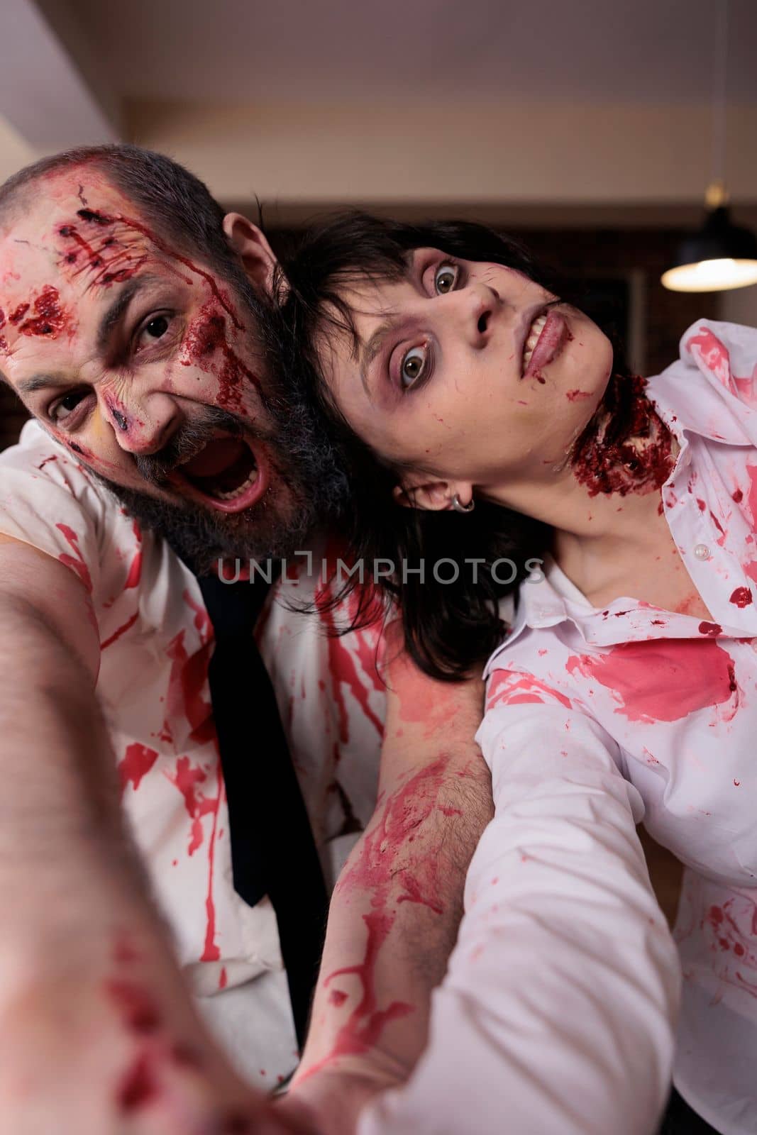Portrait of aggressive walkers with bloody scars hunting and attacking people in business office, eating brain and looking horrific. Undead gory evil walkers with spooky scratches, sinister terror.