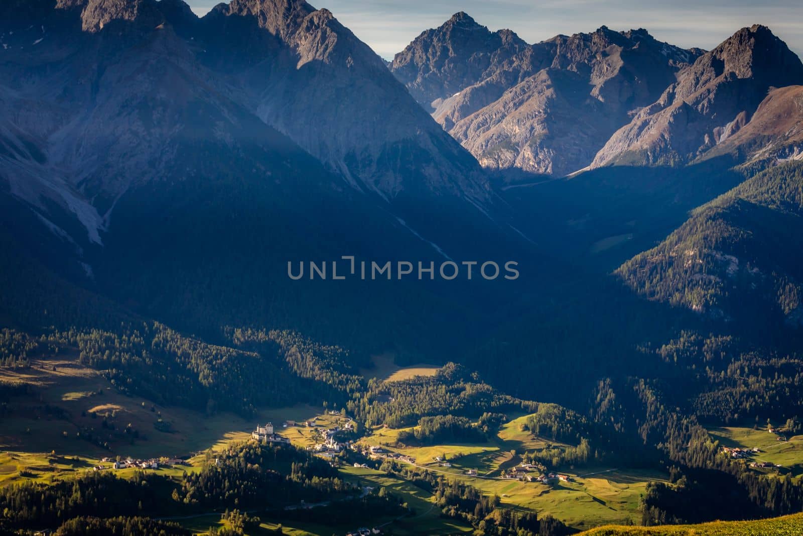 Above Idyllic landscape of Scuol Tarasp village at sunrise, Engadine, Swiss Alps, Switzerland