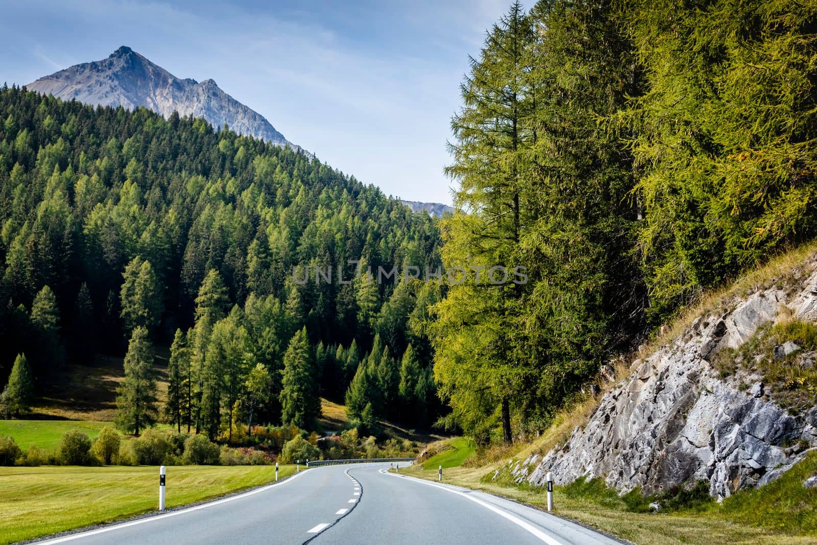 Mountain road in Engadine, dramatic road with swiss alps, Switzerland at sunny day