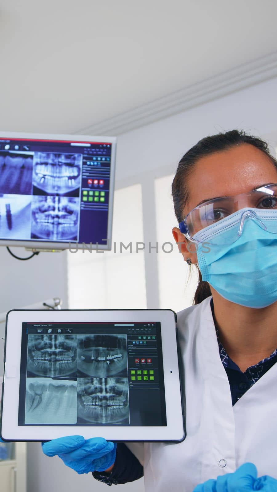 Patient pov in dental office discussing treatment of teeth using by DCStudio
