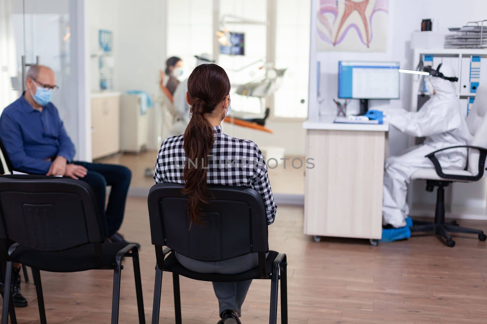 Woman patient in dentistiry office waiting for diagnosis by DCStudio