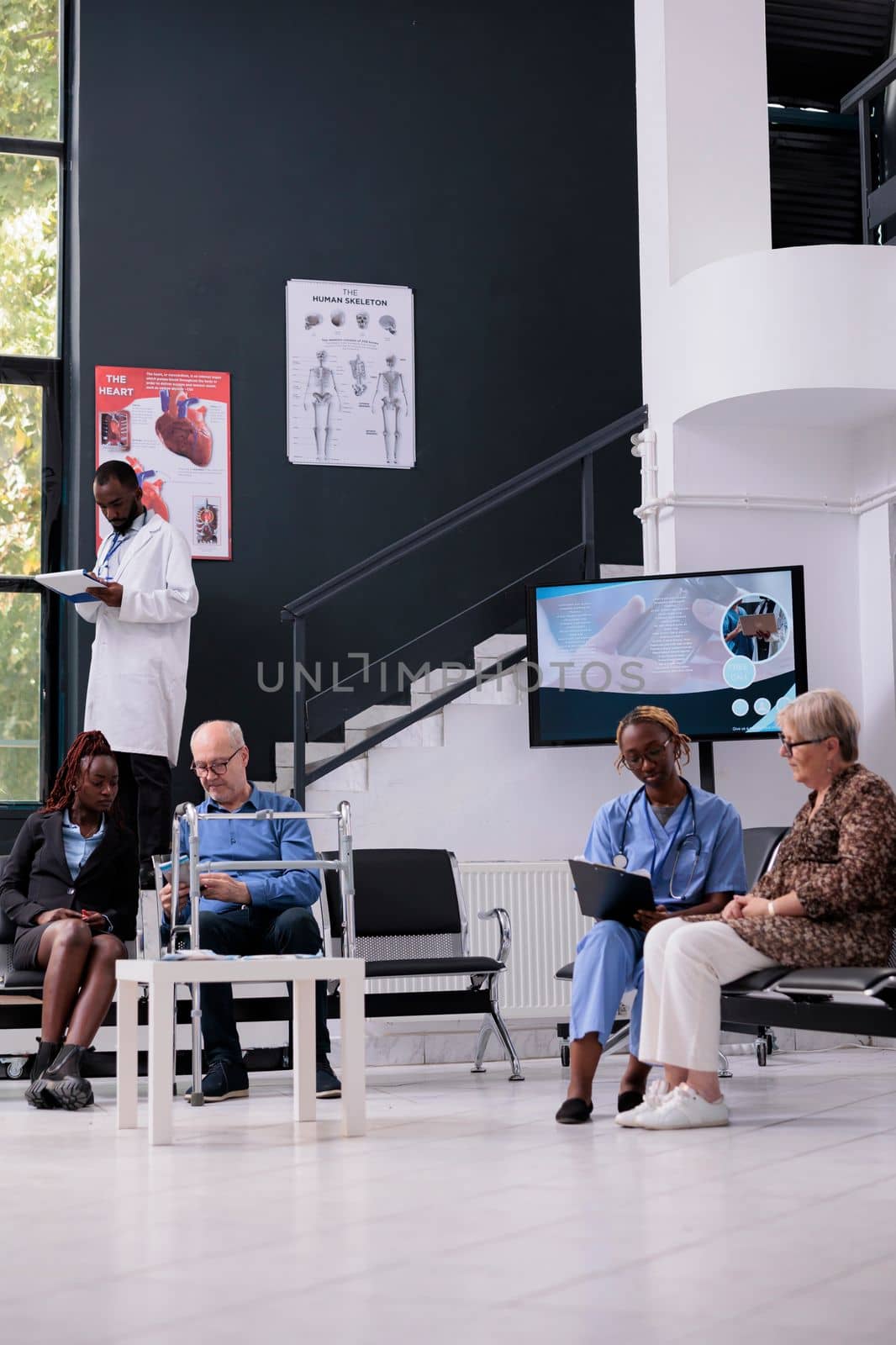 Elderly patient explaining disease symptoms to assistant during checkup visit appointment in hospital office. Nurse writing medical expertise on papers working at medication treatment