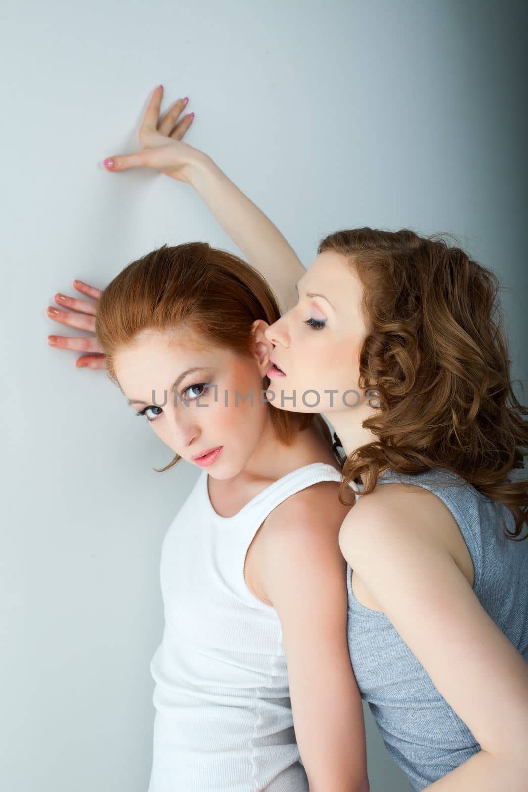 Two beauty woman in tank top near wall lesbian role playing sexual games