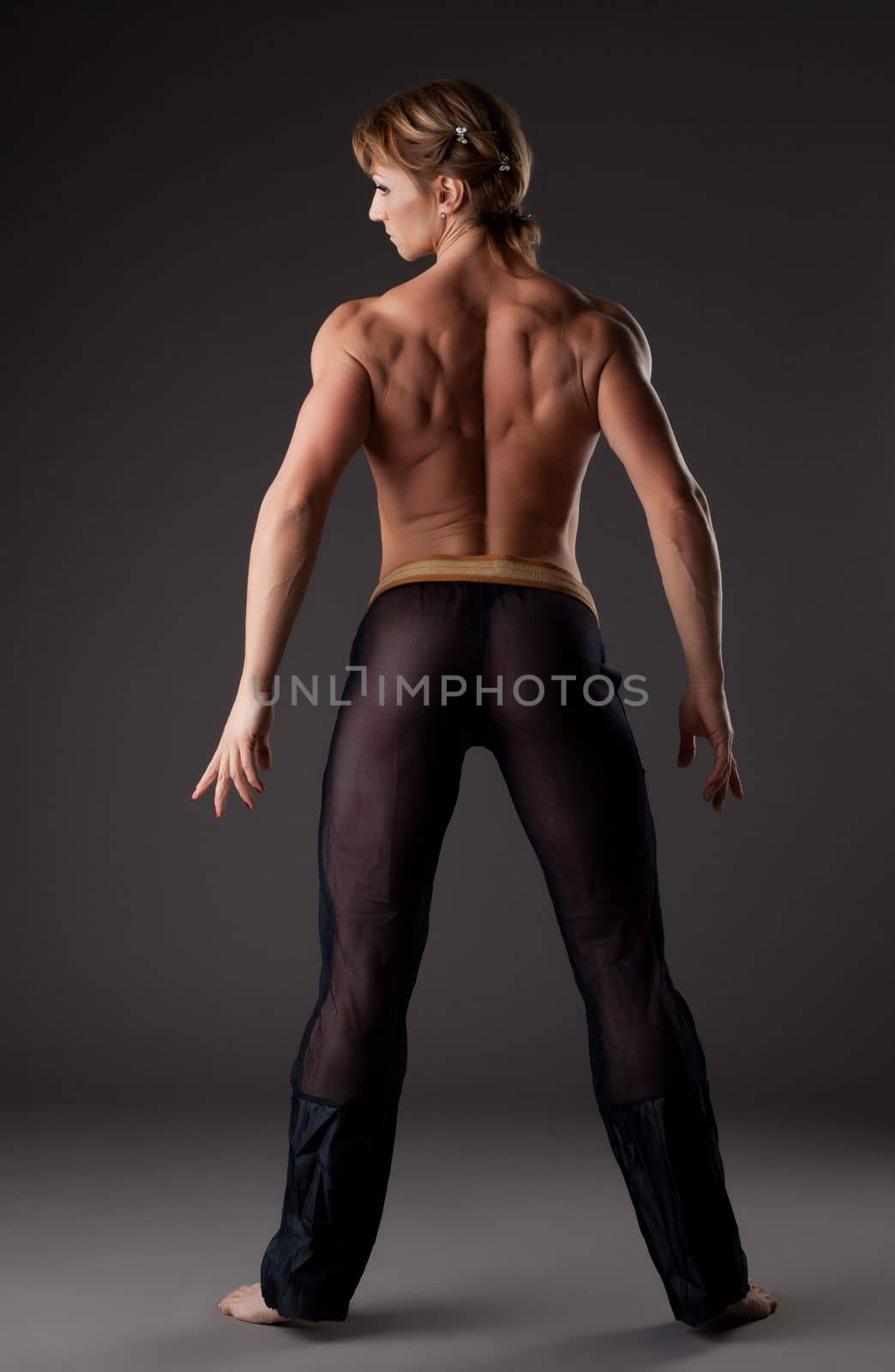 Heavy body builder woman studio portait topless