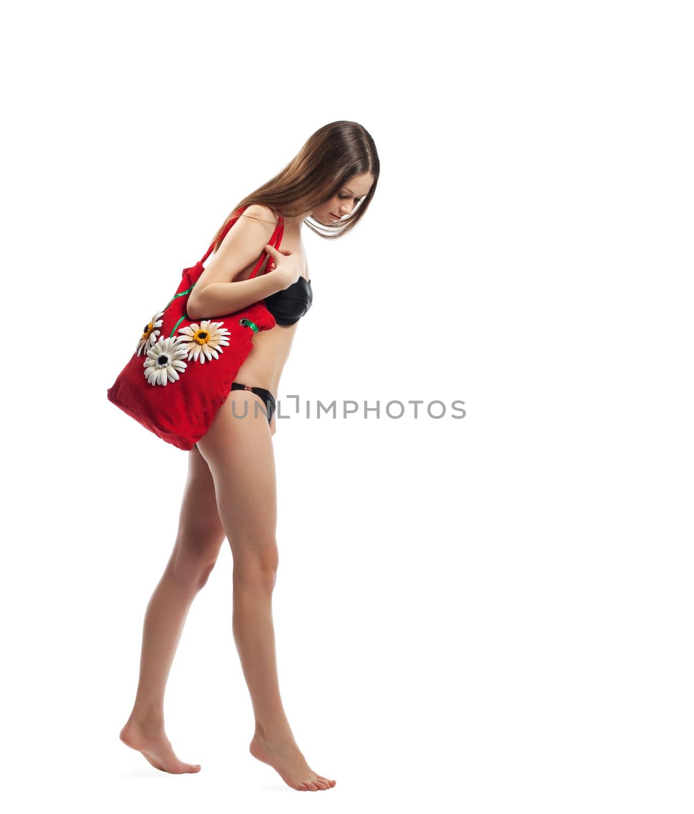 Young woman walk with red beach bag isolated