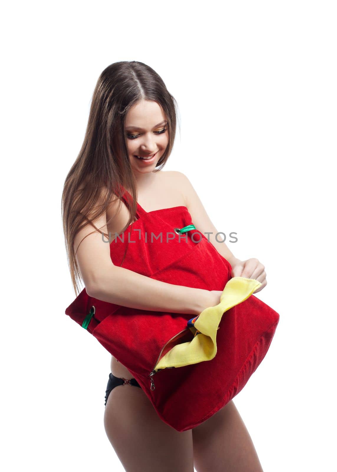 Woman with long hair take towel from red beach bag isolated