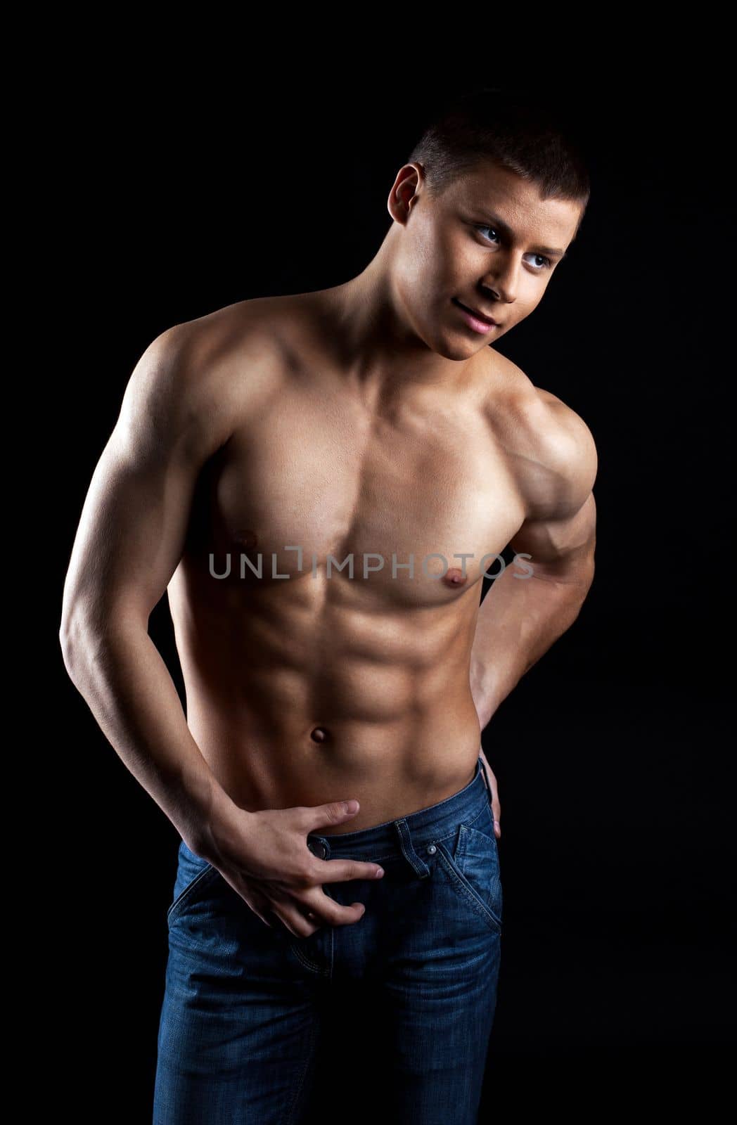 Strong naked attractive man portrait in jeans smile