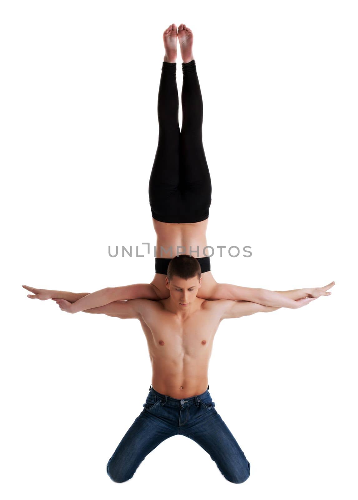 two young acrobats perform high skill exercise isolated
