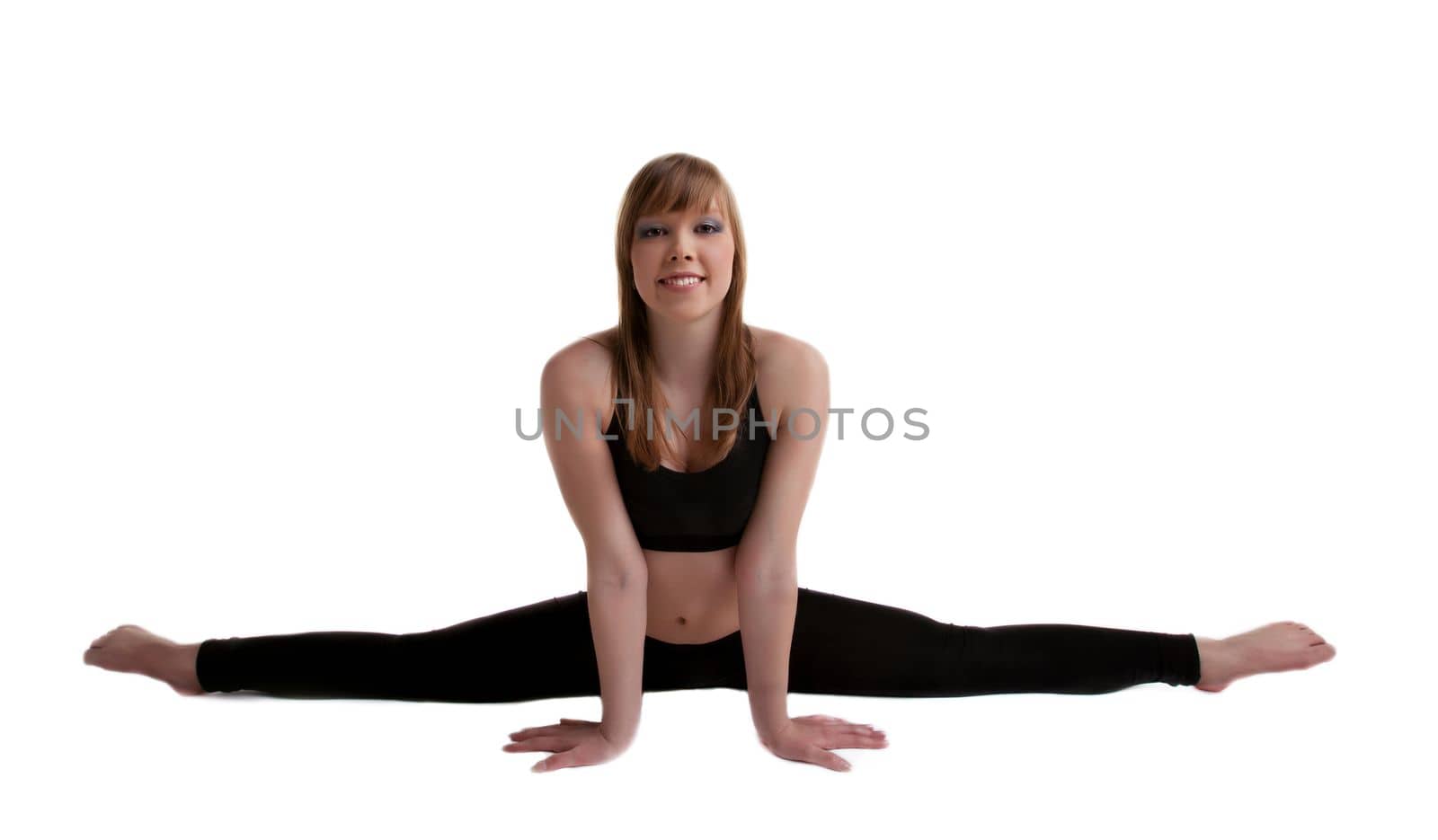 young gymnast in black show split isolated
