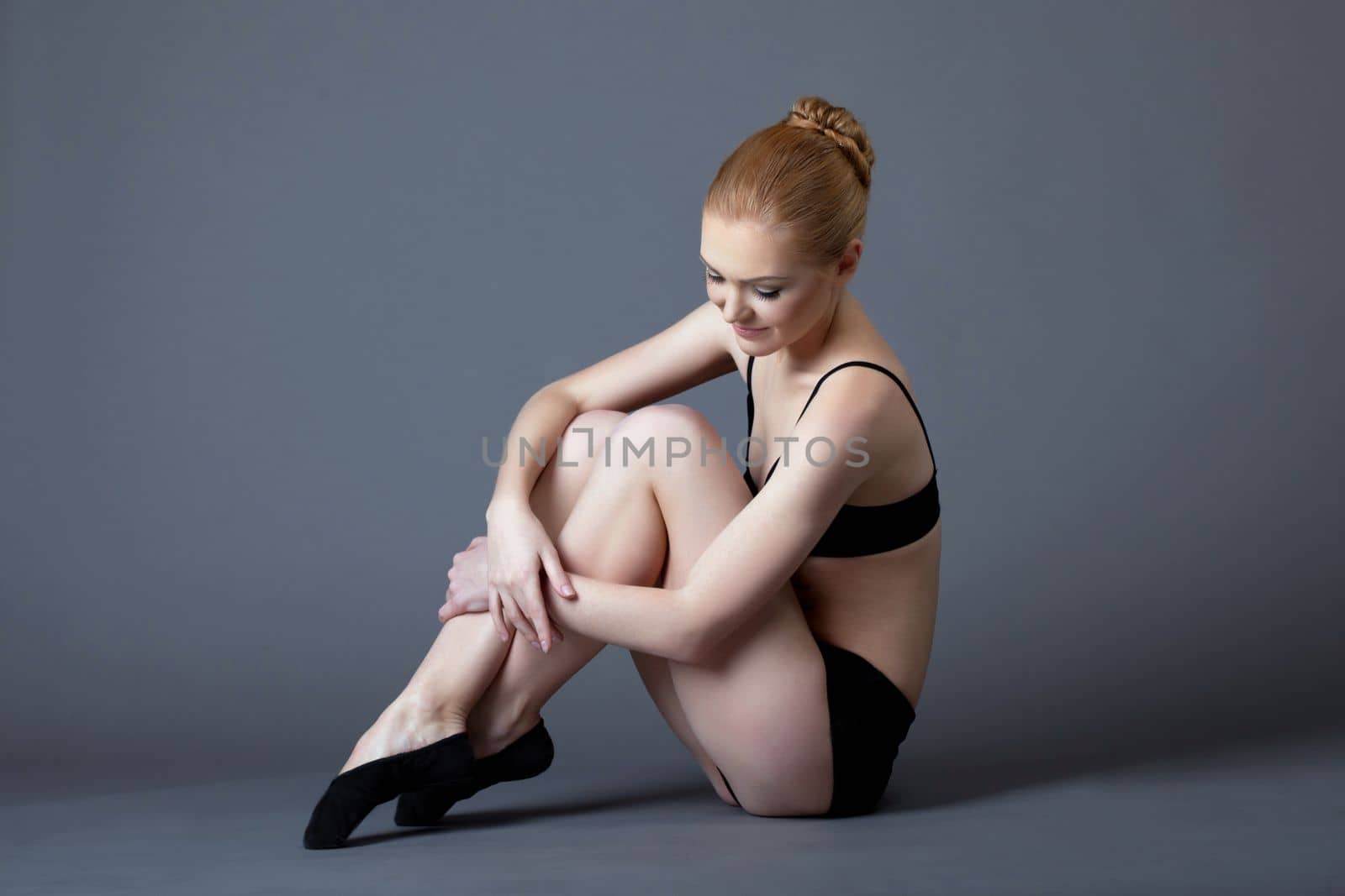 Beauty ballet girl after training in dark under light