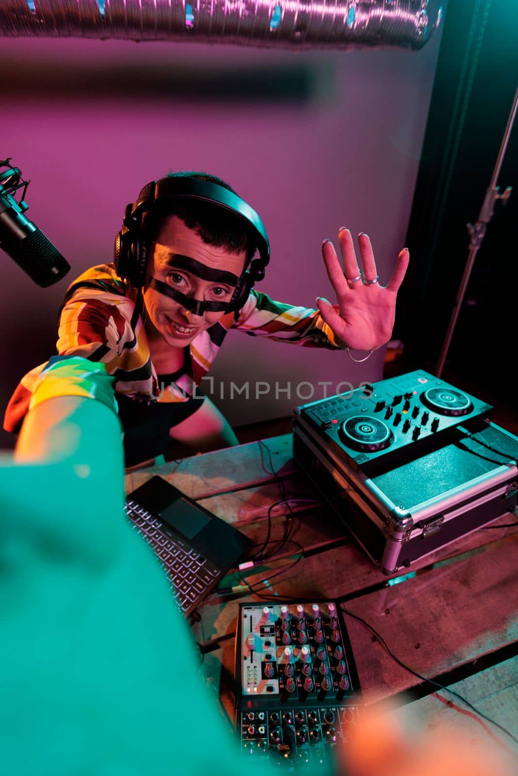 Woman dj artist mixing sounds on turntables, using buttons and bass key to mix techno music. Musician performing with mixer at nightclub, using electric control panel, disc jockey.