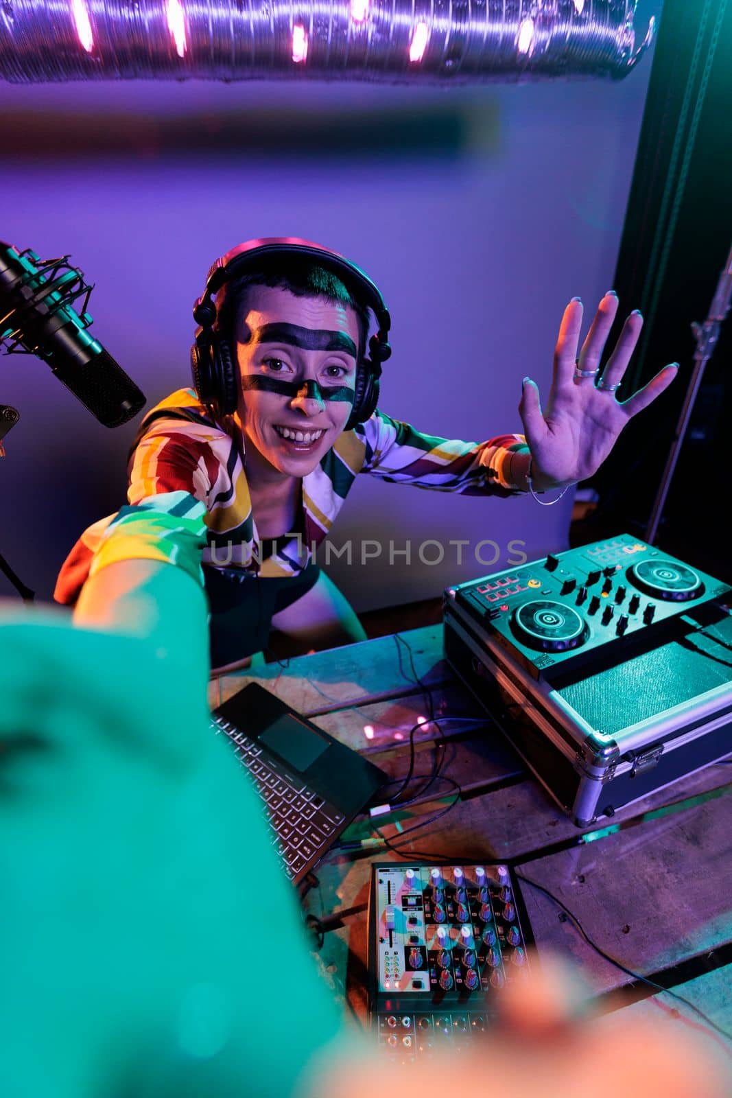 Female dj producer mixing sounds on turntables by DCStudio