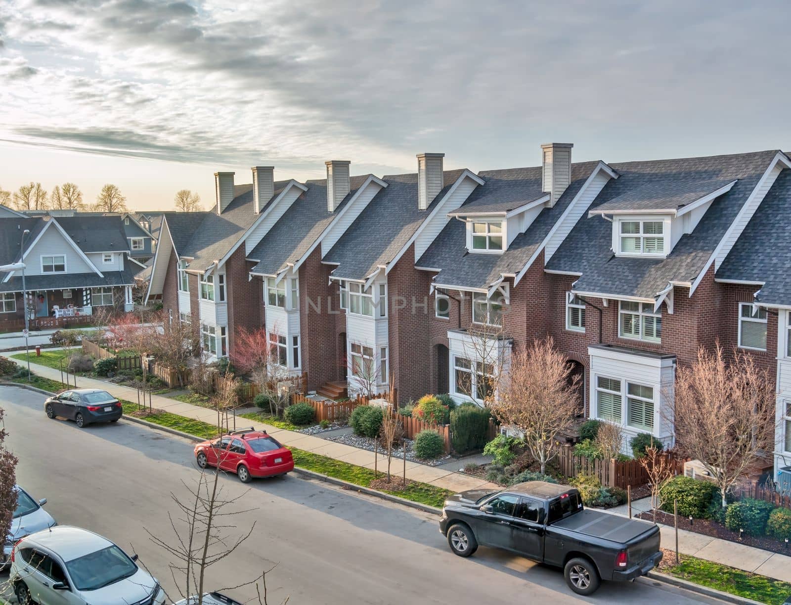 Residential area of Queensborough community with the row of townhouses along the street.